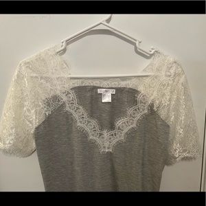 Venus Xs laced sleeved shirt. More of a small than XS. Never worn.